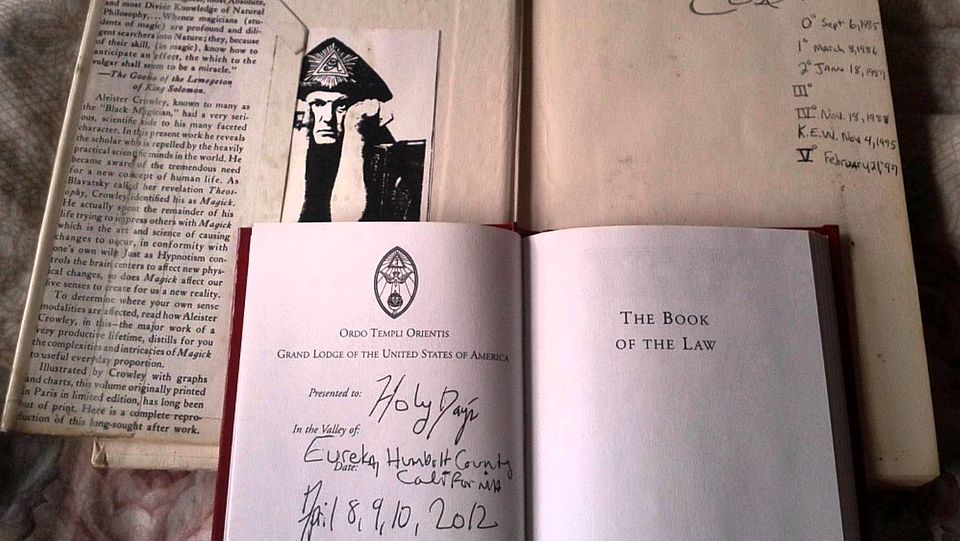 Picture of open books with 'occult' texts (Aleister Crowley)